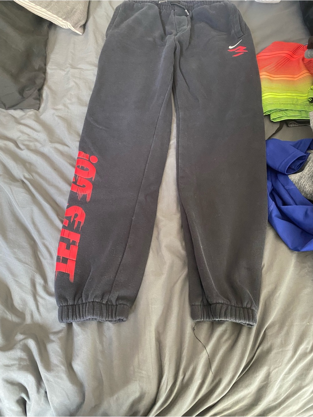 Nike Black Joggers with Red Side Graphic